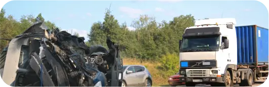 a car crash with a car in the background