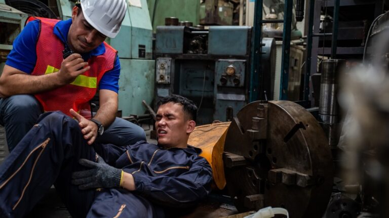 Man hurt on the job with a safety worker calling it in