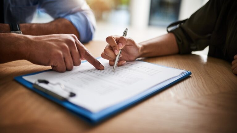 People working on insurance paperwork