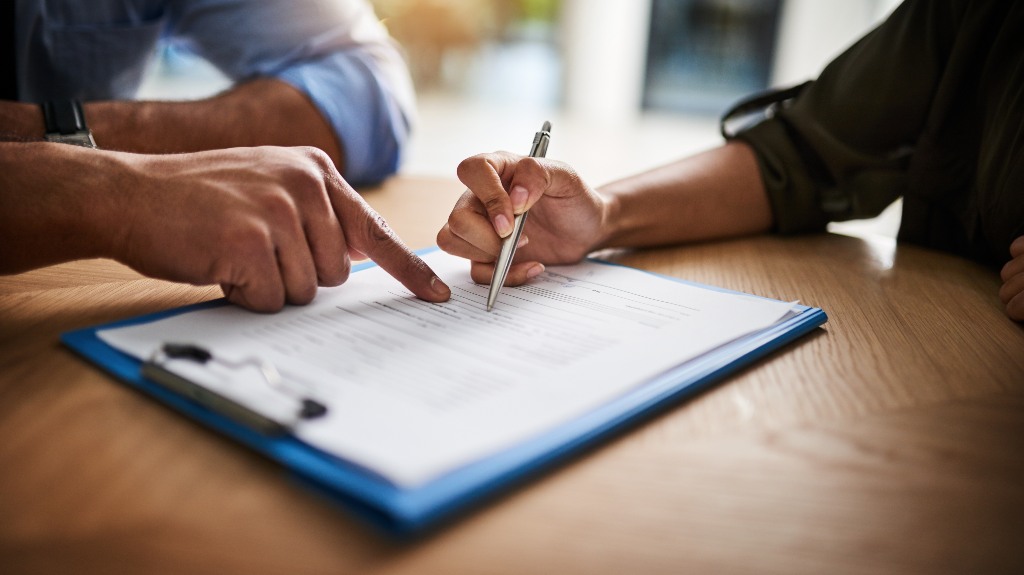 People working on insurance paperwork