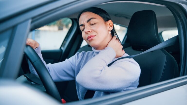 Woman with a hurt neck after a car accident