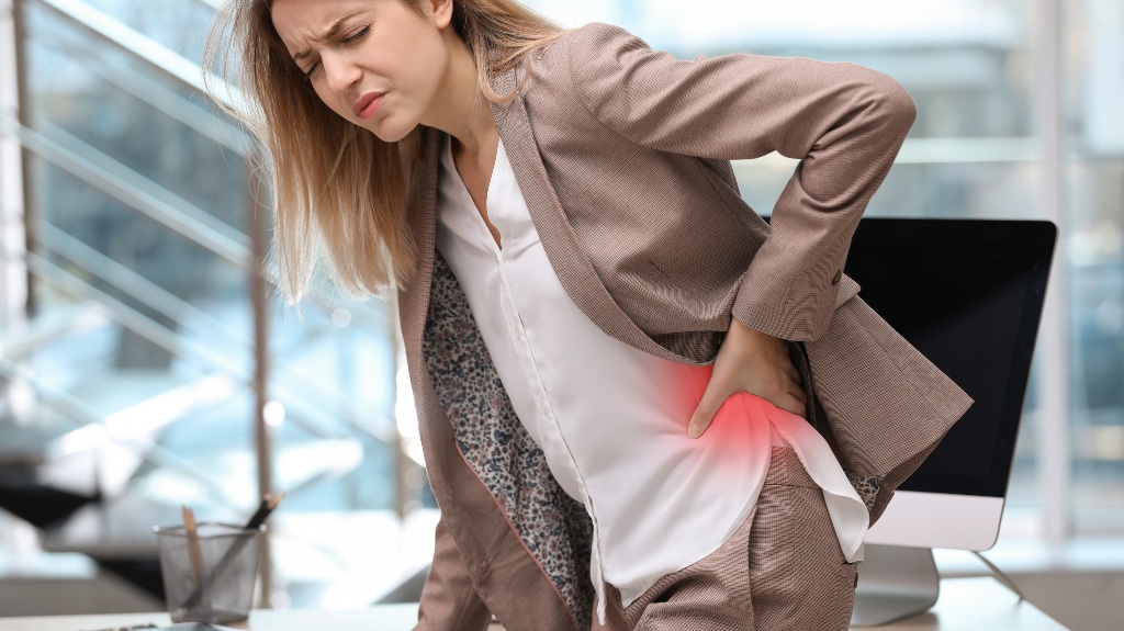 woman with a hurt back in the office