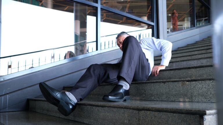 man falls down stairs at work
