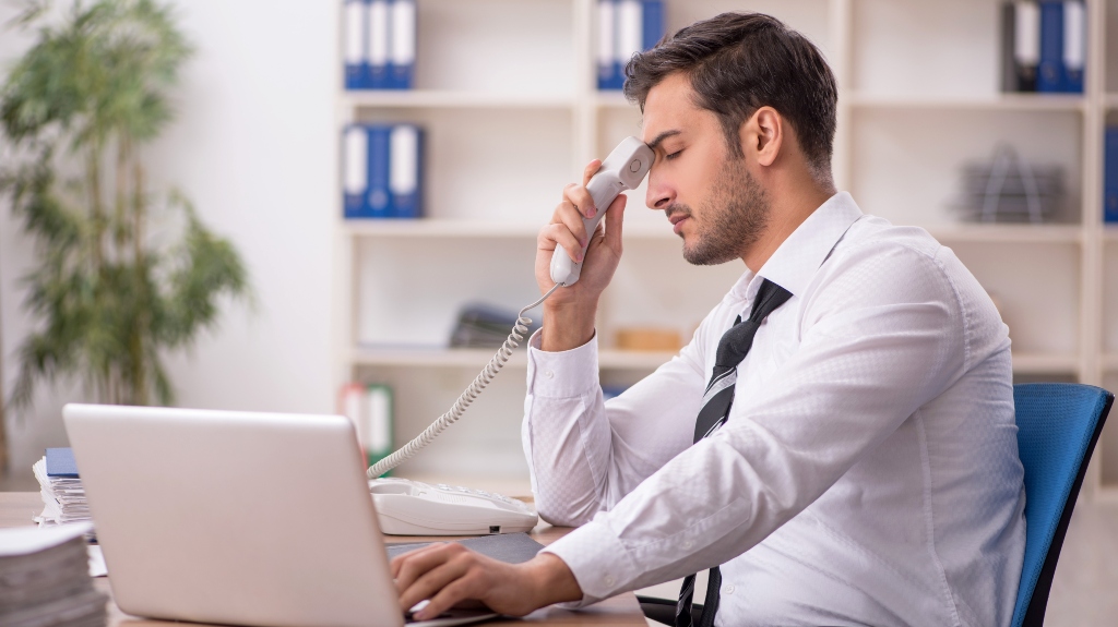 Young stressed male employee