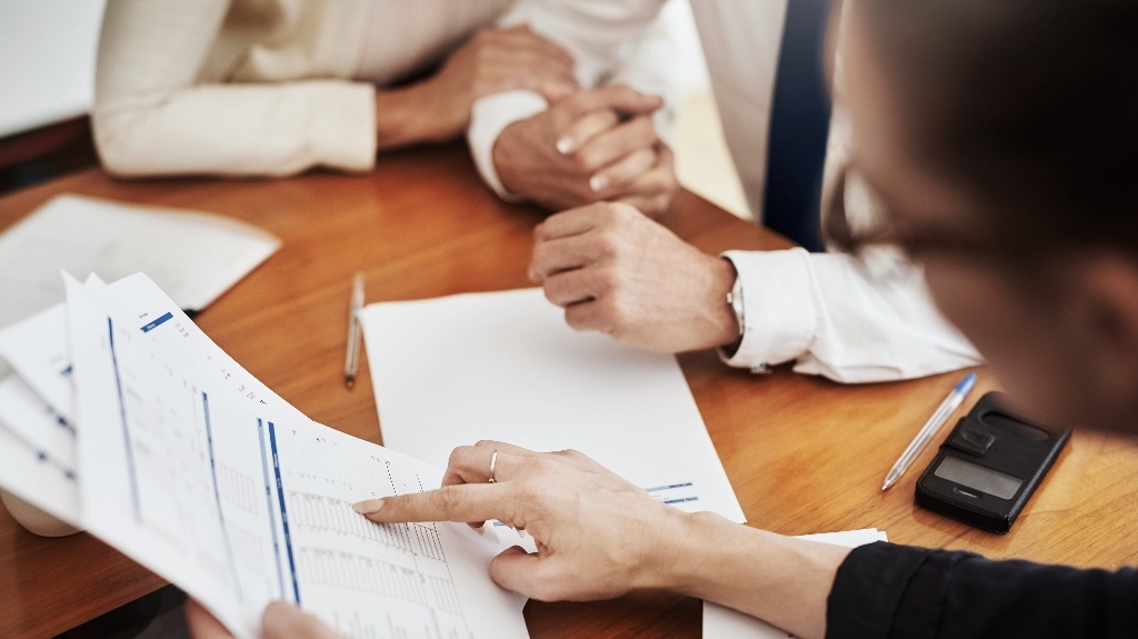 lawyer is consulting clients about breach of trust for business