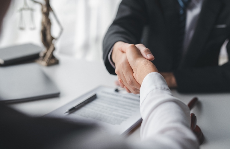 Lawyer shaking hands with a client