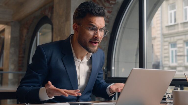 Stressed mad furious angry Arabian Indian man businessman male guy