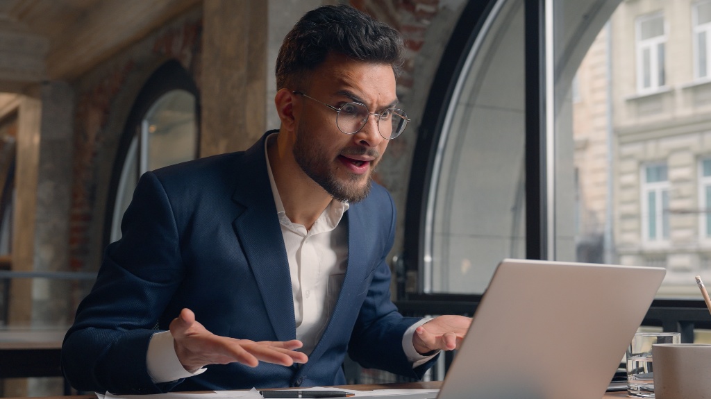 Stressed mad furious angry Arabian Indian man businessman male guy